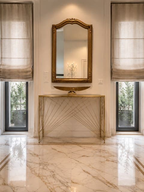 Linen roman blinds in a reception area with a marble floor